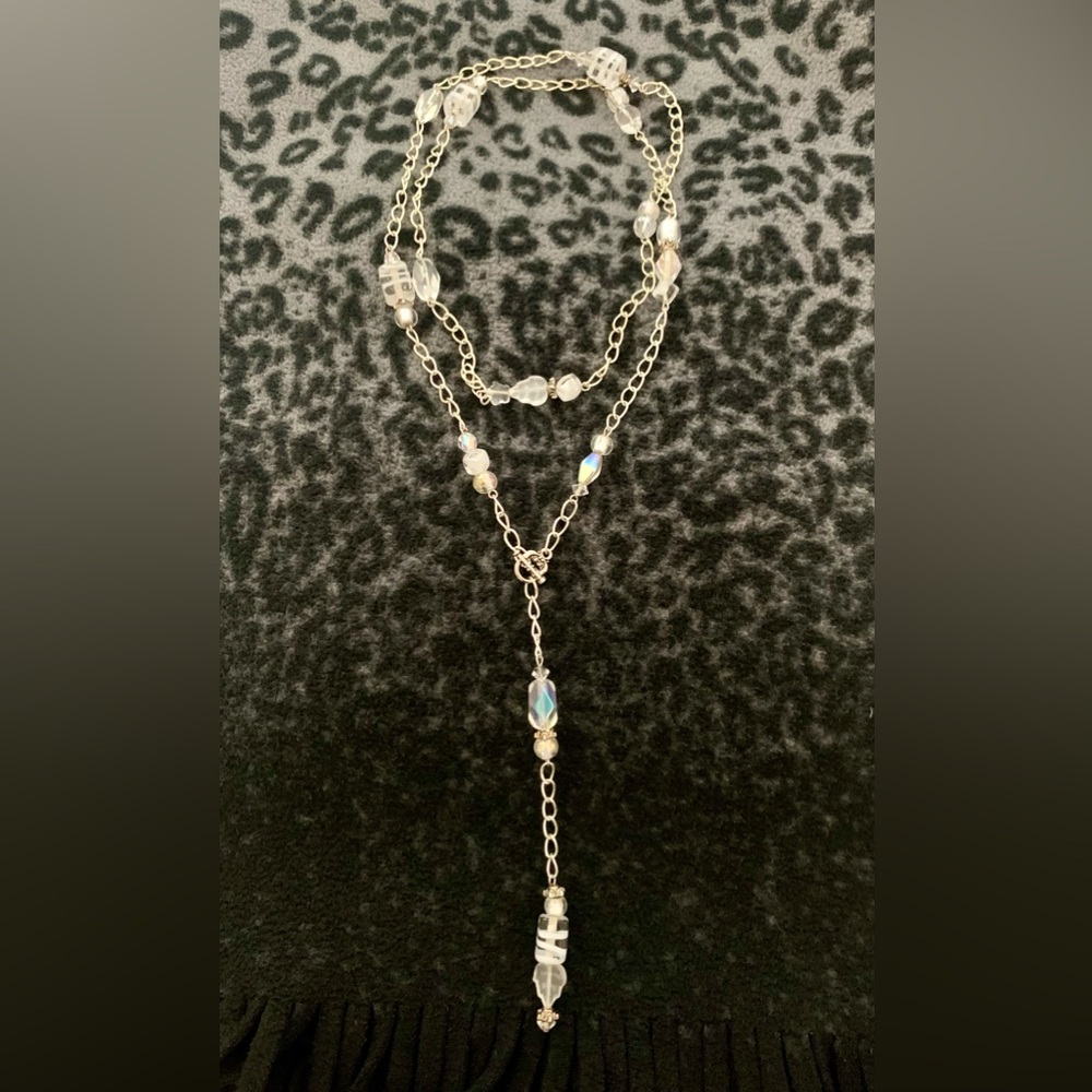 Glass bead and silver tone lariat necklace.